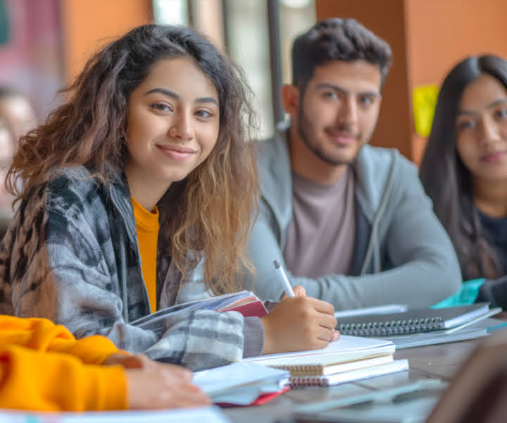Students taking notes in a classroom